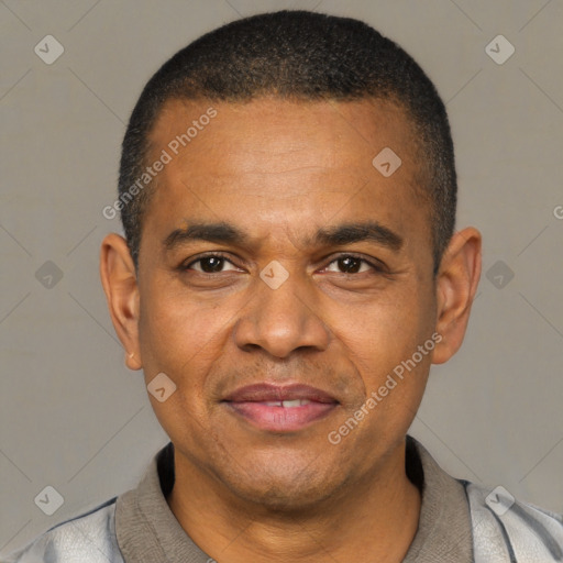 Joyful latino adult male with short  black hair and brown eyes