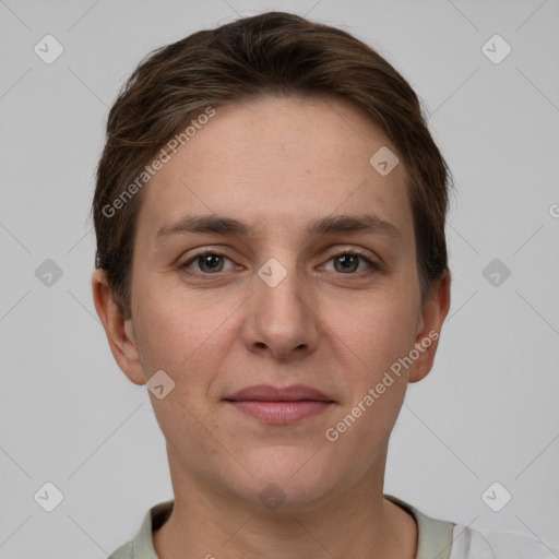 Joyful white young-adult female with short  brown hair and grey eyes