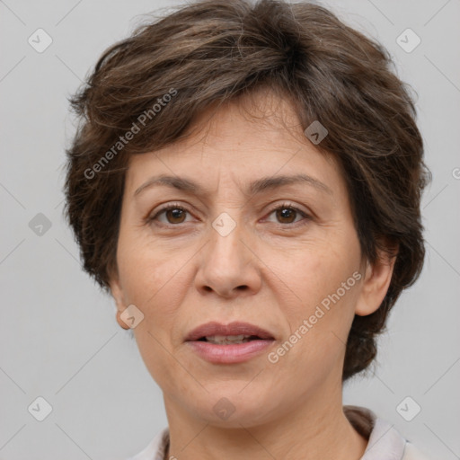 Joyful white adult female with short  brown hair and brown eyes