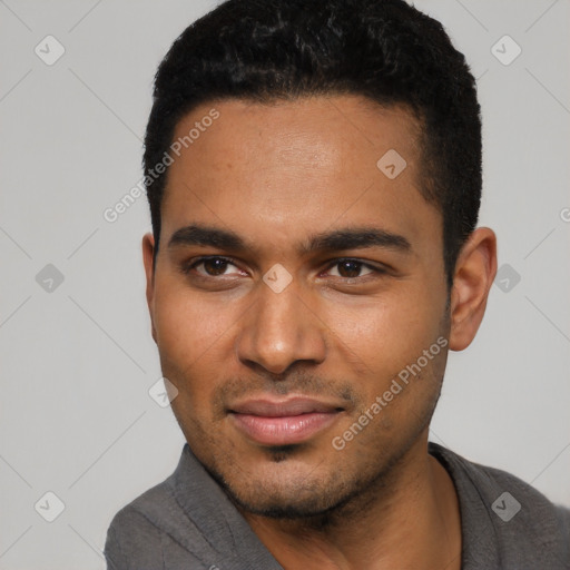 Joyful black young-adult male with short  black hair and brown eyes