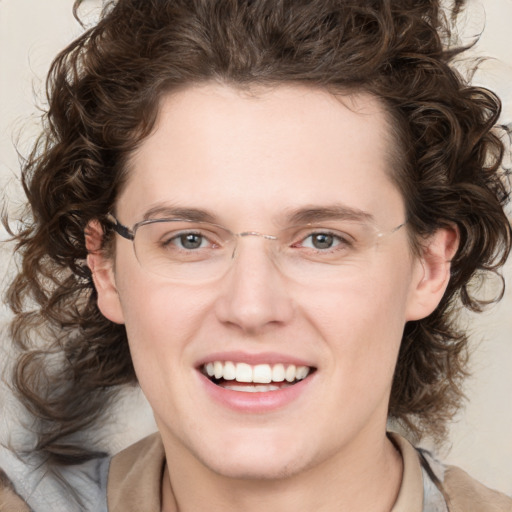 Joyful white young-adult female with medium  brown hair and green eyes