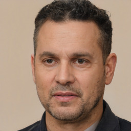 Neutral white adult male with short  black hair and brown eyes