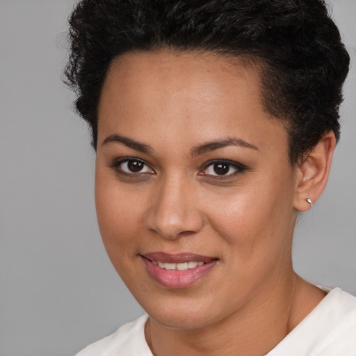 Joyful white young-adult female with short  brown hair and brown eyes
