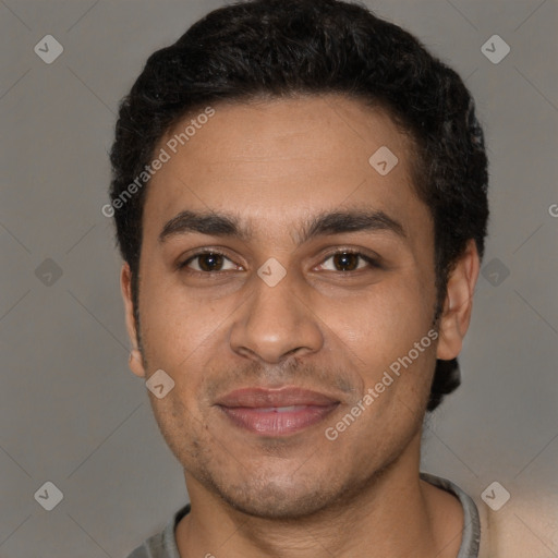 Joyful latino young-adult male with short  brown hair and brown eyes