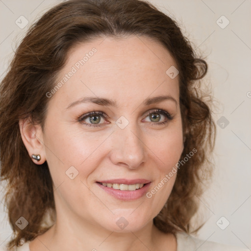 Joyful white young-adult female with medium  brown hair and green eyes