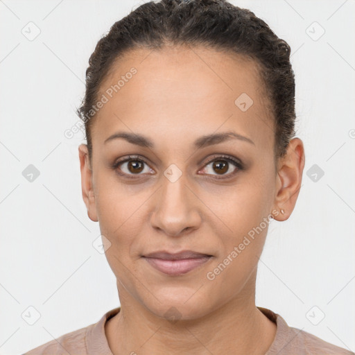 Joyful latino young-adult female with short  brown hair and brown eyes