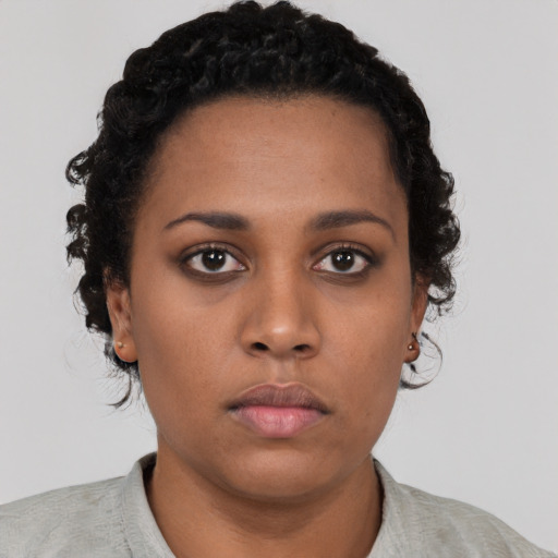 Neutral black young-adult female with short  black hair and brown eyes
