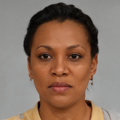Neutral latino young-adult female with short  black hair and brown eyes