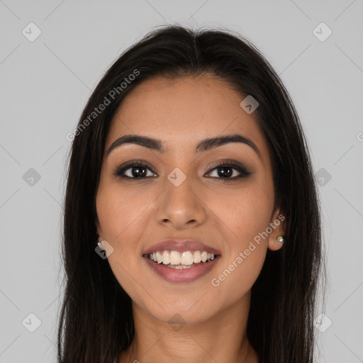 Joyful latino young-adult female with long  brown hair and brown eyes