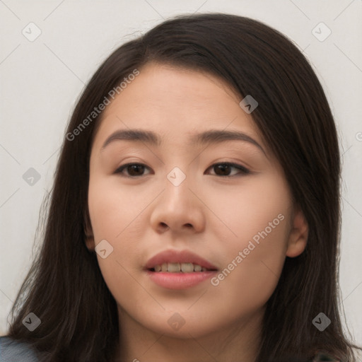 Joyful asian young-adult female with long  brown hair and brown eyes