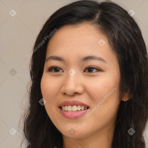 Joyful asian young-adult female with long  brown hair and brown eyes