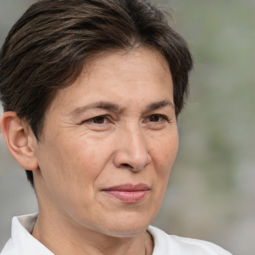 Joyful white middle-aged female with medium  brown hair and brown eyes