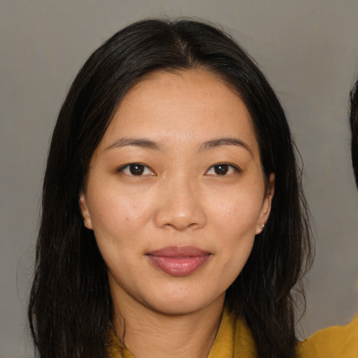 Joyful asian young-adult female with medium  brown hair and brown eyes