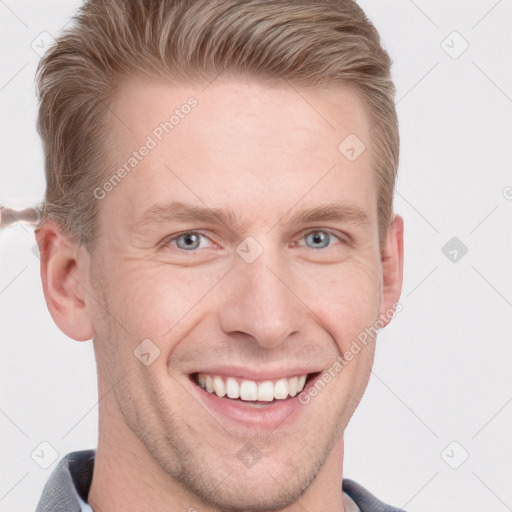 Joyful white adult male with short  brown hair and grey eyes