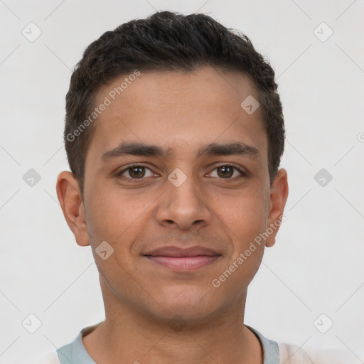 Joyful latino young-adult male with short  brown hair and brown eyes