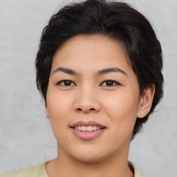 Joyful asian young-adult female with short  brown hair and brown eyes