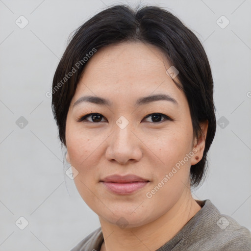 Joyful asian young-adult female with medium  black hair and brown eyes