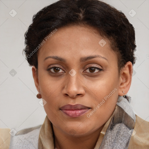 Joyful latino young-adult female with short  brown hair and brown eyes