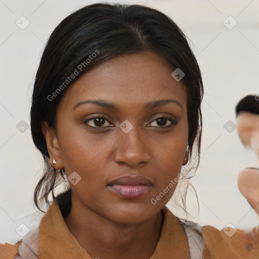 Neutral black young-adult female with medium  brown hair and brown eyes