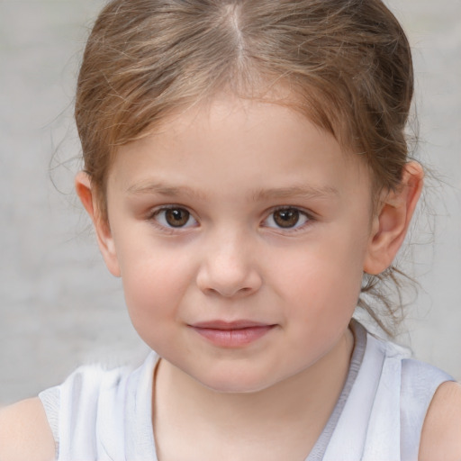 Joyful white child female with short  brown hair and brown eyes