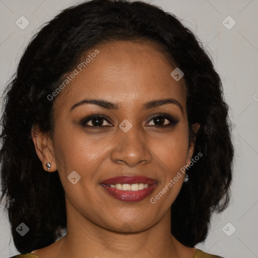 Joyful black young-adult female with long  brown hair and brown eyes