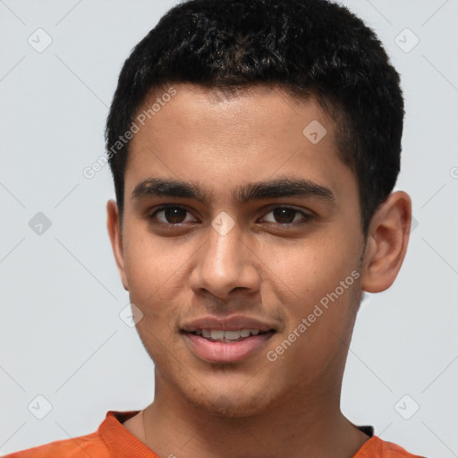 Joyful latino young-adult male with short  brown hair and brown eyes