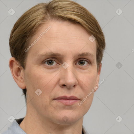 Joyful white adult female with short  brown hair and grey eyes