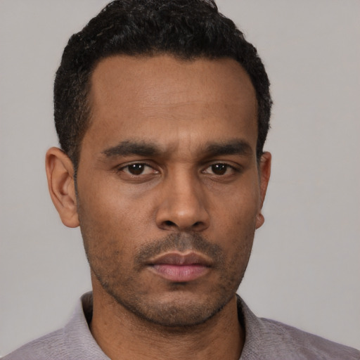 Neutral latino young-adult male with short  black hair and brown eyes