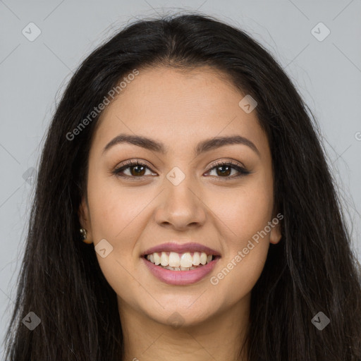 Joyful latino young-adult female with long  brown hair and brown eyes