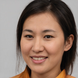 Joyful white young-adult female with medium  brown hair and brown eyes