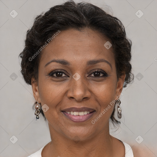 Joyful black adult female with short  brown hair and brown eyes