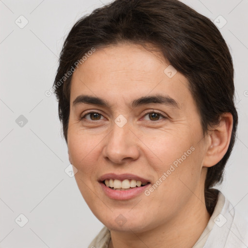 Joyful white young-adult female with short  brown hair and brown eyes