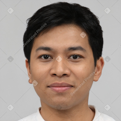 Joyful latino young-adult male with short  black hair and brown eyes