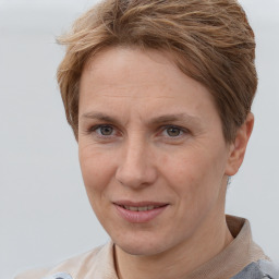 Joyful white adult female with short  brown hair and brown eyes