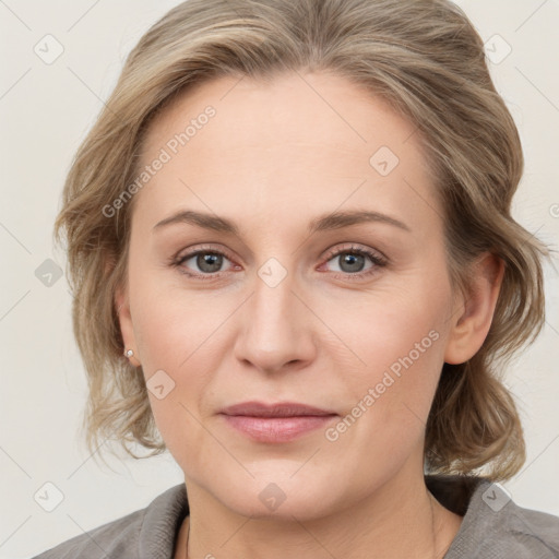 Joyful white young-adult female with medium  brown hair and blue eyes