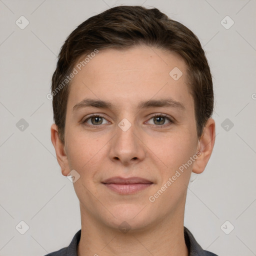 Joyful white young-adult female with short  brown hair and grey eyes