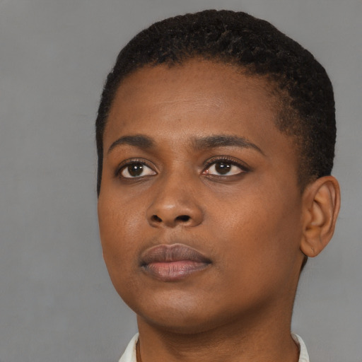Neutral black young-adult female with short  brown hair and brown eyes