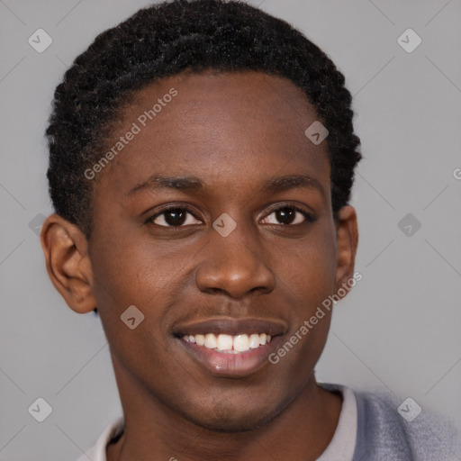 Joyful black young-adult male with short  brown hair and brown eyes