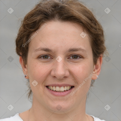 Joyful white young-adult female with short  brown hair and grey eyes