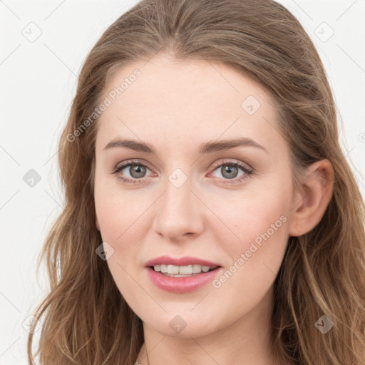 Joyful white young-adult female with long  brown hair and blue eyes