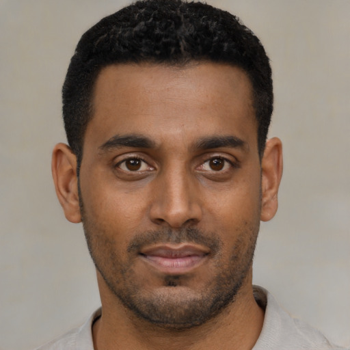 Neutral black young-adult male with short  black hair and brown eyes