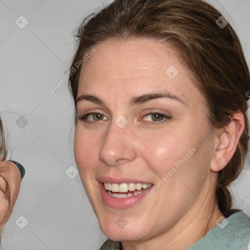 Joyful white young-adult female with medium  brown hair and blue eyes