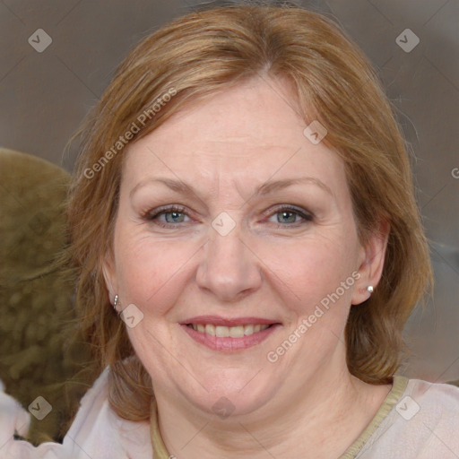 Joyful white adult female with medium  brown hair and blue eyes