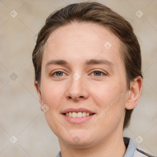 Joyful white young-adult female with short  brown hair and grey eyes