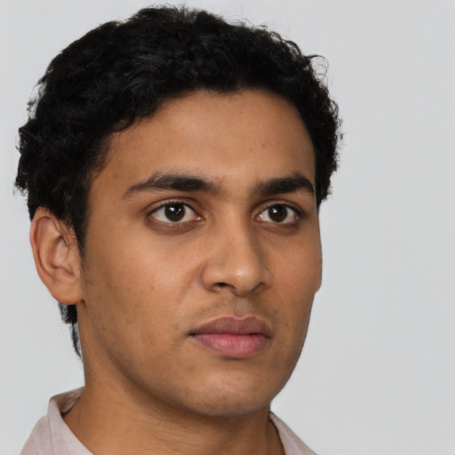 Neutral latino young-adult male with short  brown hair and brown eyes