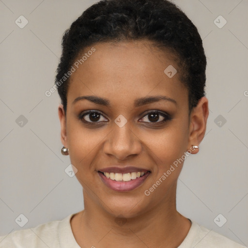 Joyful black young-adult female with short  black hair and brown eyes