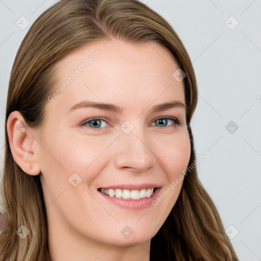 Joyful white young-adult female with long  brown hair and blue eyes