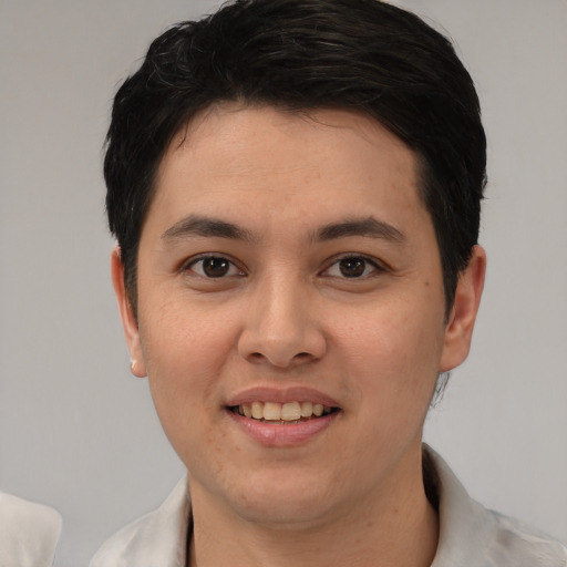 Joyful white young-adult male with short  black hair and brown eyes