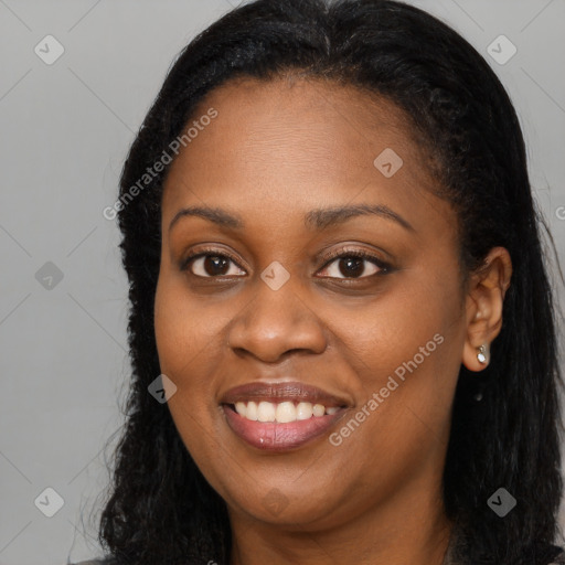 Joyful black young-adult female with long  brown hair and brown eyes