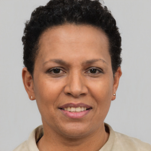 Joyful latino adult female with short  brown hair and brown eyes